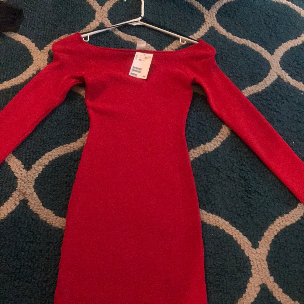 Long slim off shoulder red dress.